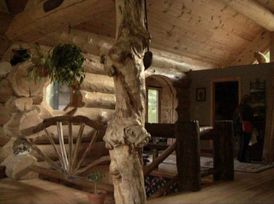 Rustic log home interior with natural post